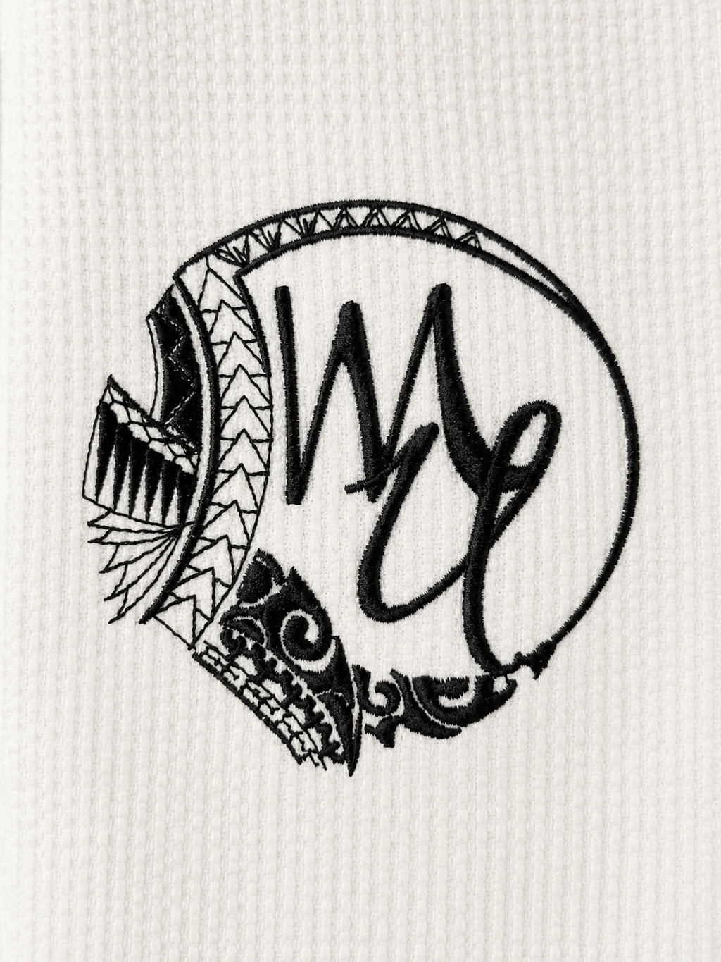 Logo brodé Mana Univers sur kimono JJB